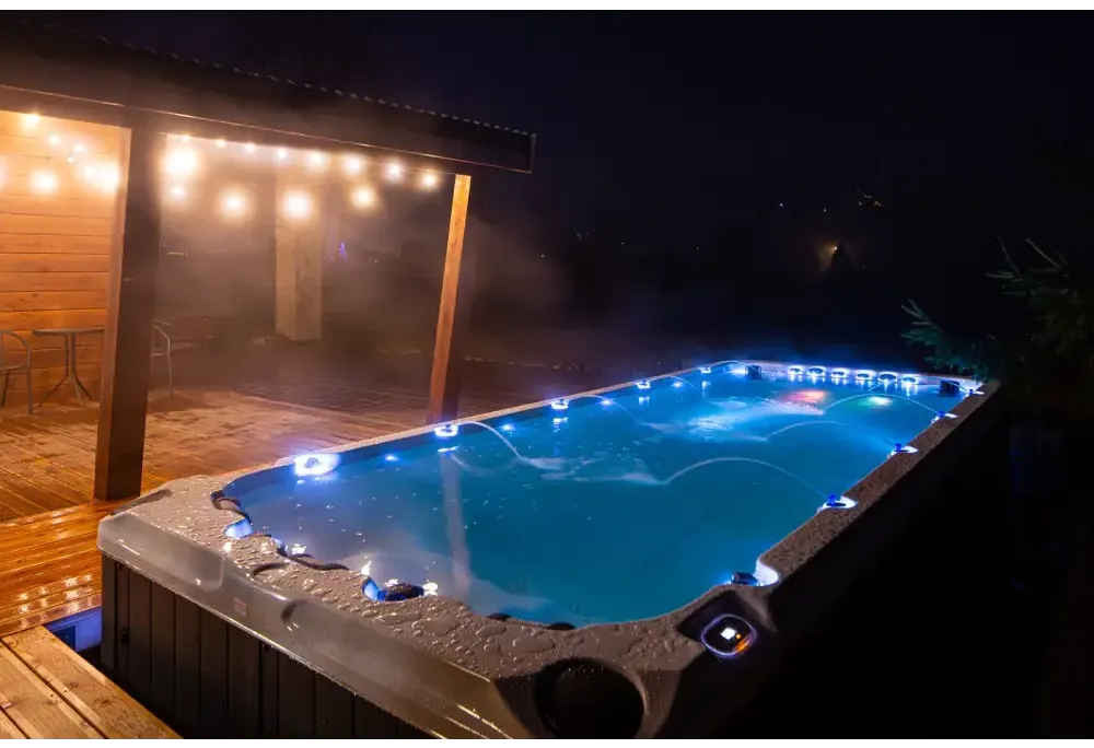 PassionSpa Activity 2 Deep swim spa – blue lighting, grey textured surface, edge lighting